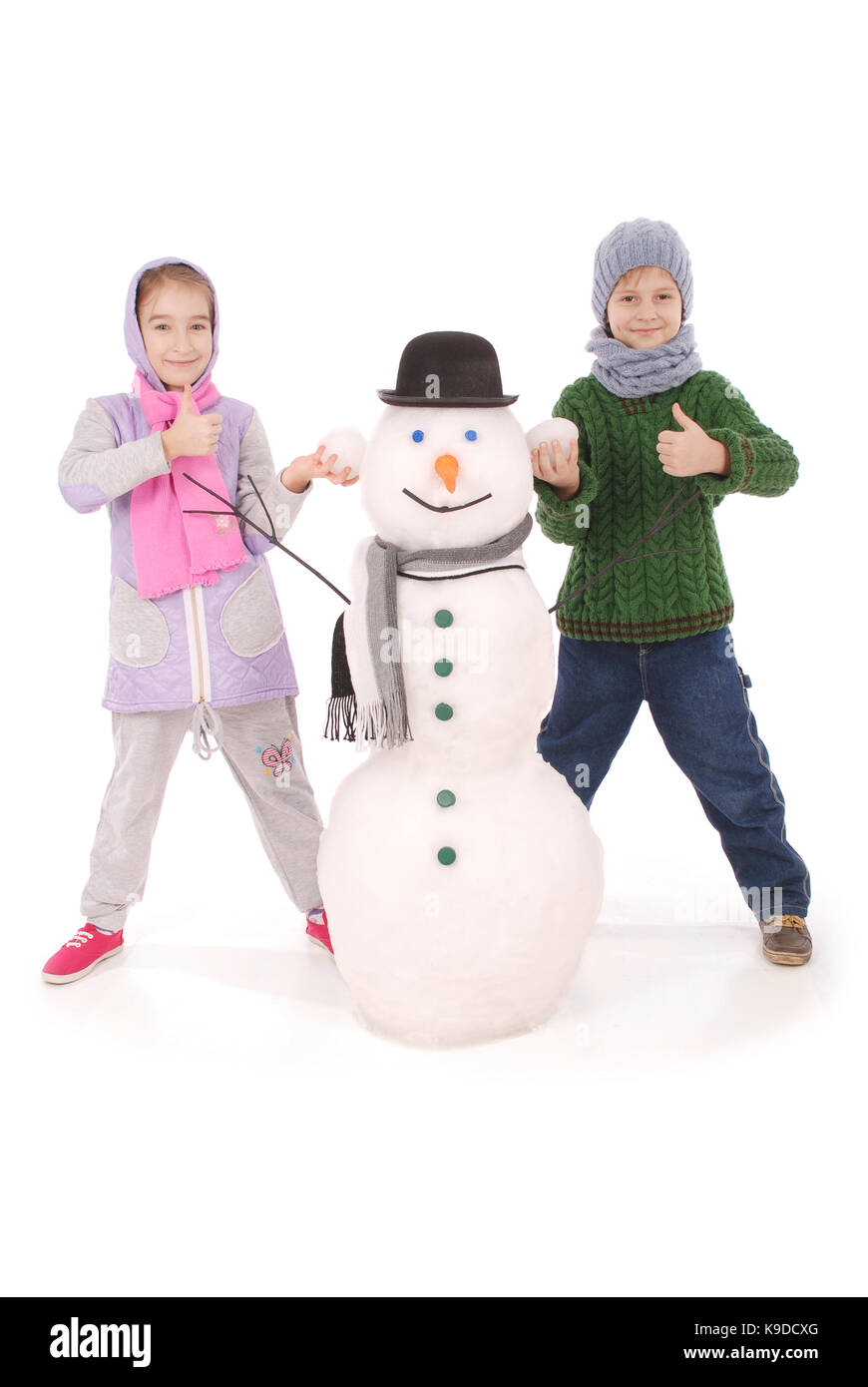 Cute boy and girl with snowman with scarf and hat on white background ...