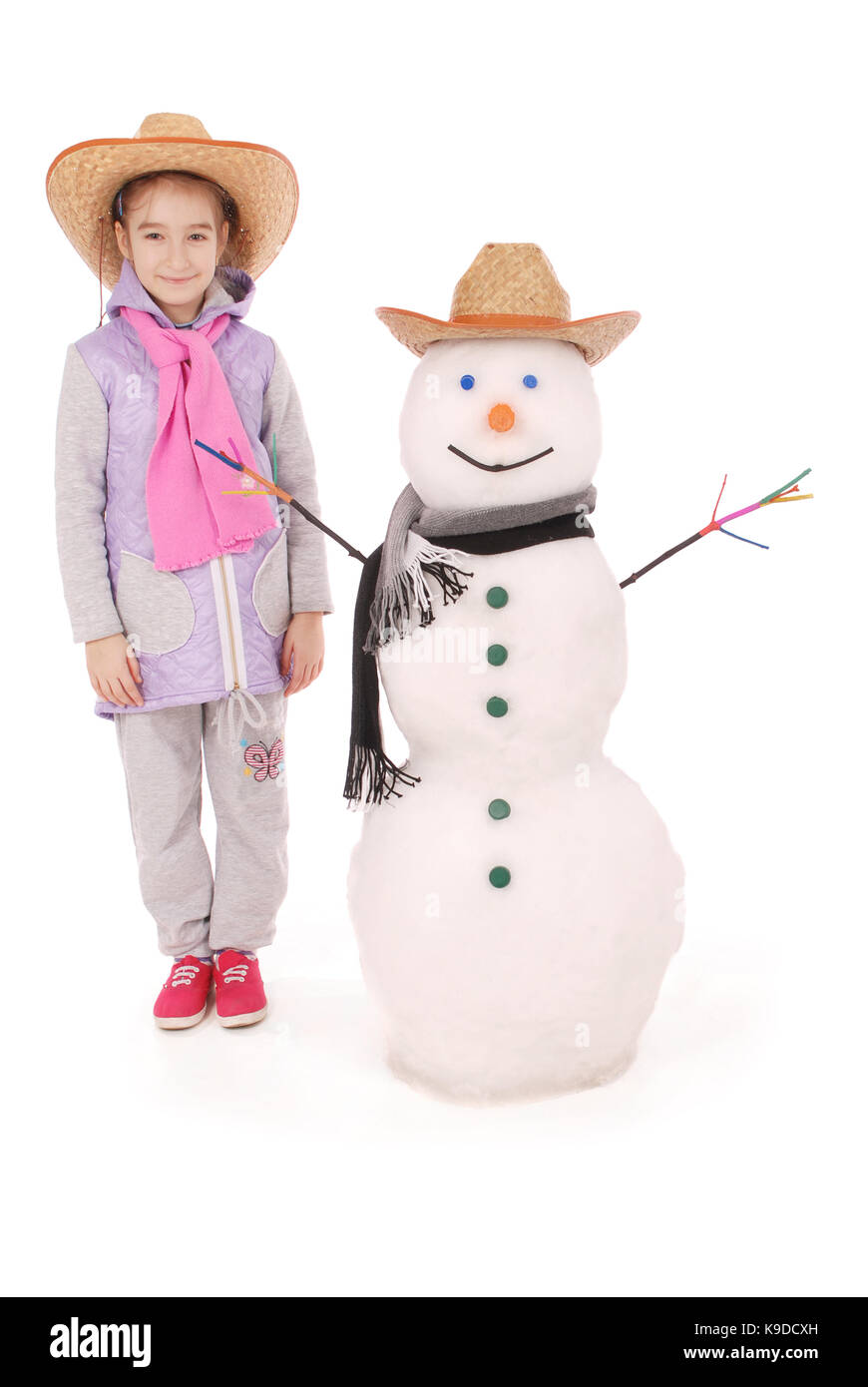 Cute girl with snowman with scarf and hat on white background Stock ...