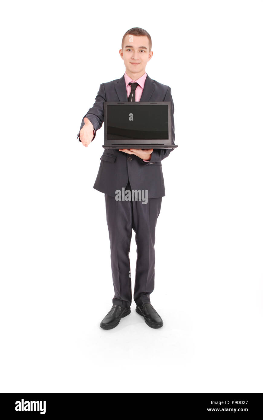Full length portrait of confident mature businessman with a laptop in ...