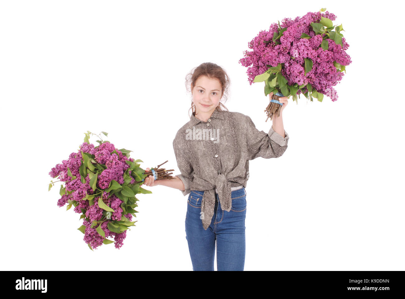 Teenage girl standing with lilac in both hands. Isolated on white ...