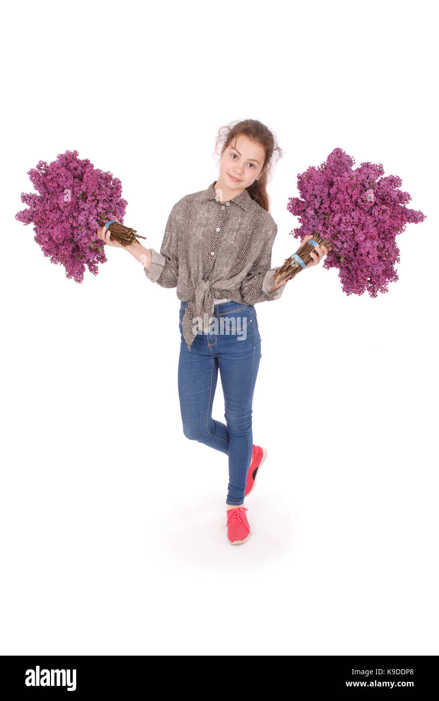 Teenage girl standing with lilac in both hands. Isolated on white ...