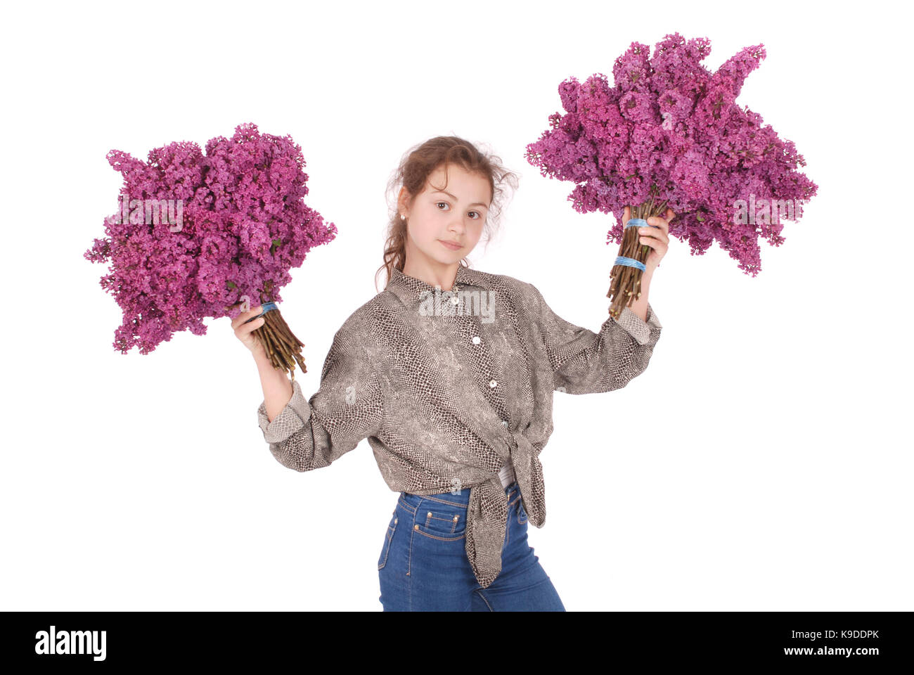 Teenage girl standing with lilac in both hands. Isolated on white ...