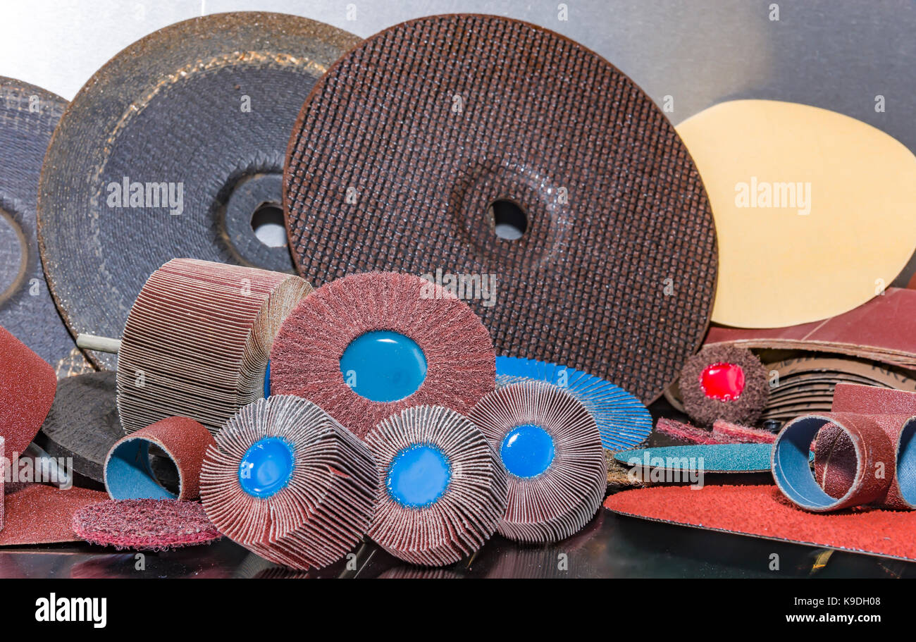 A pile of color abrasive sandpaper for metal working sandpaper for