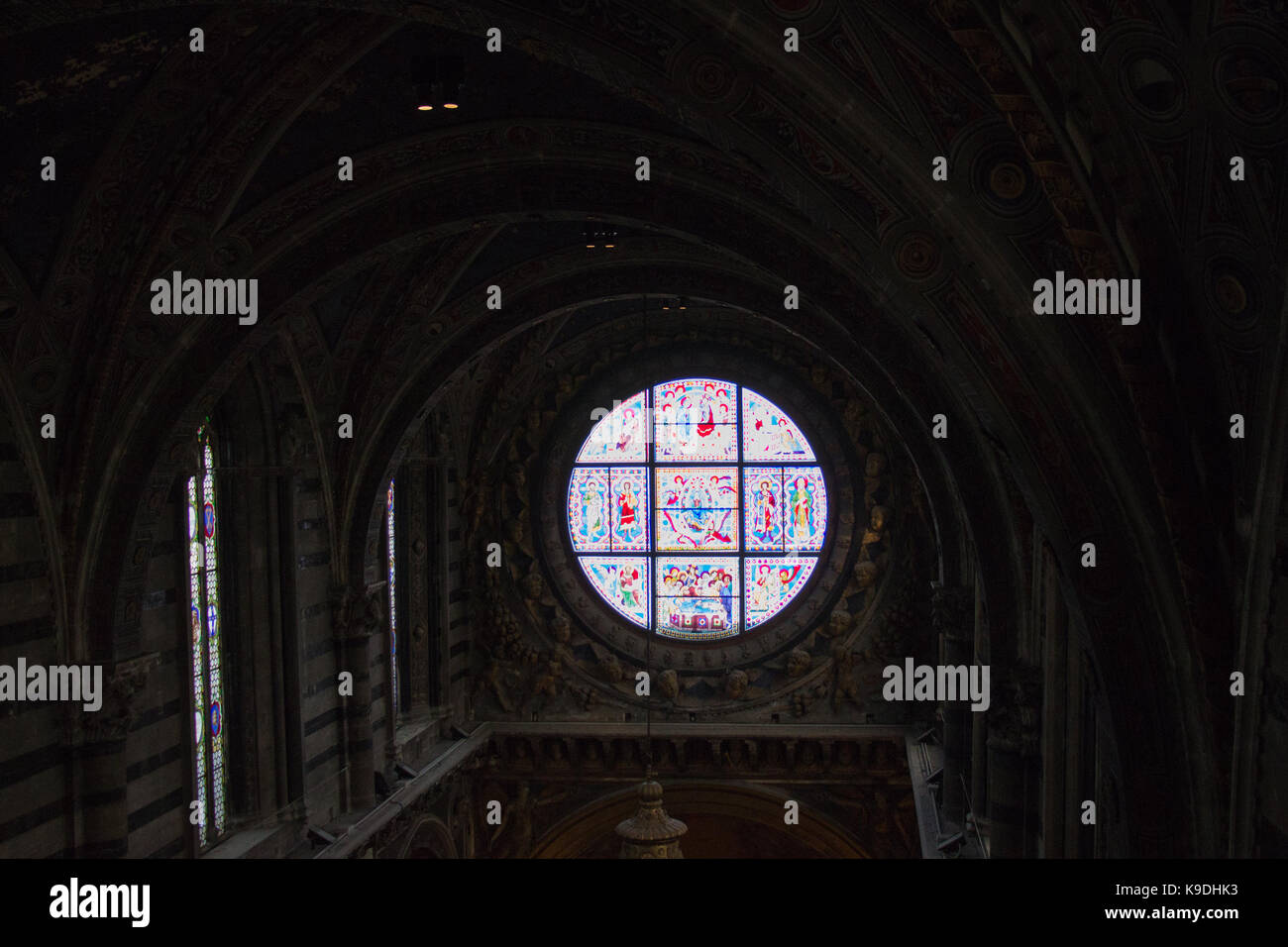 Italy, Siena - December 26 2016: interior view of Metropolitan Cathedral of Santa Maria Assunta. Duccio di buoninsegna is stained glass window of the  Stock Photo