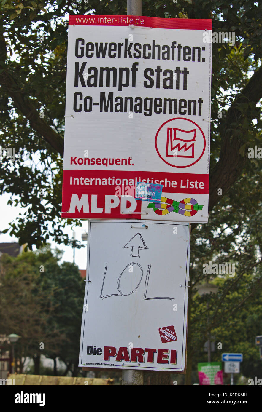 Election poster of the German Marxist Leninist Party with a funny LOL poster of the satirist group 'The Party' below Stock Photo