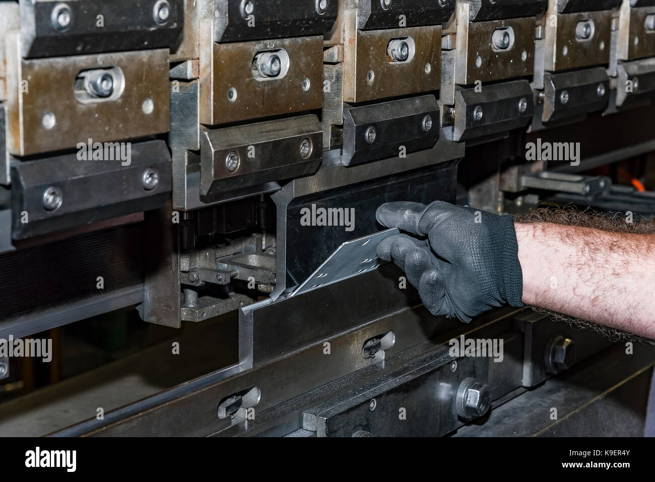 operator bending metal sheet by sheet bending machine bending of metal ...