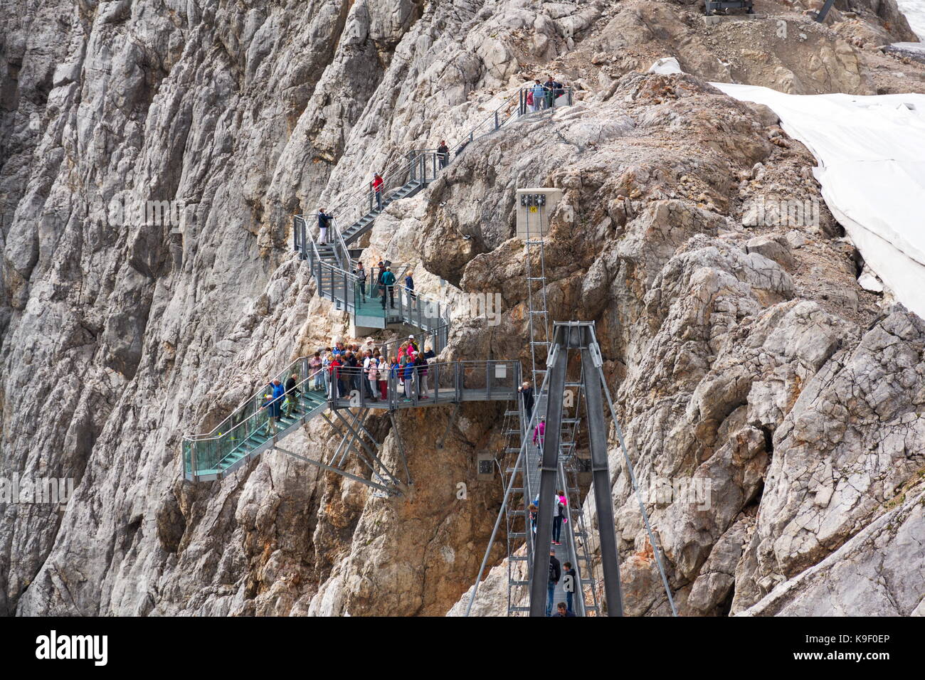 RAMSAU AM DACHSTEIN, AUSTRIA - AUGUST 17: Tourists walk on the Austrias highest suspension bridge Dachstein Suspension bridge on August 17, 2017 in Ra Stock Photo