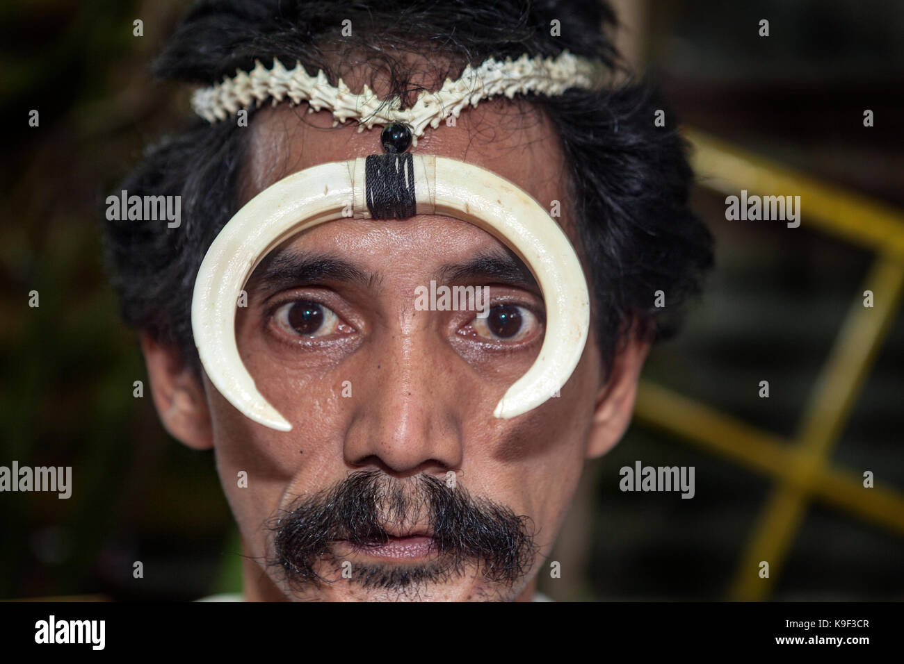 Unusual portrait of an Asian Filipino man who is a bone seller living in Puerto Princesa, Palawan Island, Philippines. Stock Photo