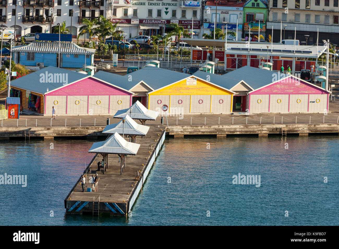 Fort-de-France, Martinique.  Early Morning Fishermen on the Pier by the Souvenir Market for Cruise Ships. Stock Photo