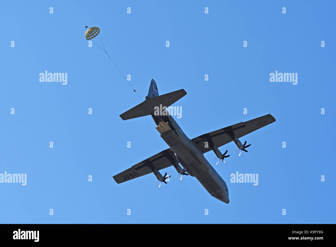 Heavy Drop From C-130 Hercules Stock Photo