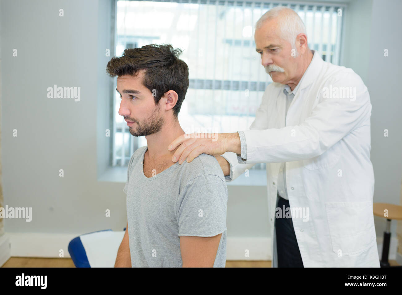 young patient visiting a physiotherapist Stock Photo
