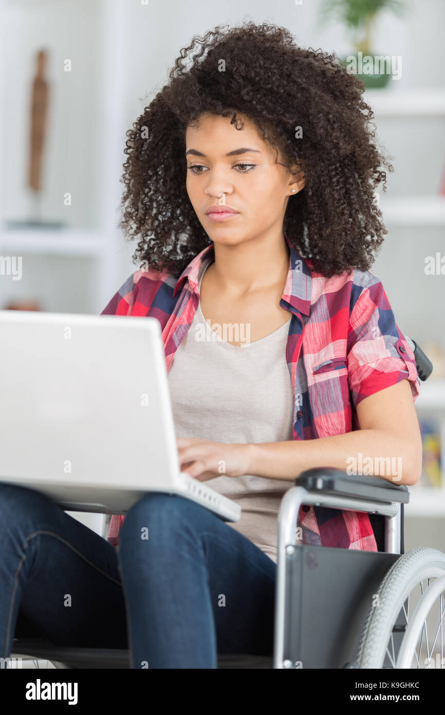 job for disabled people woman on wheelchair with laptop Stock Photo Alamy