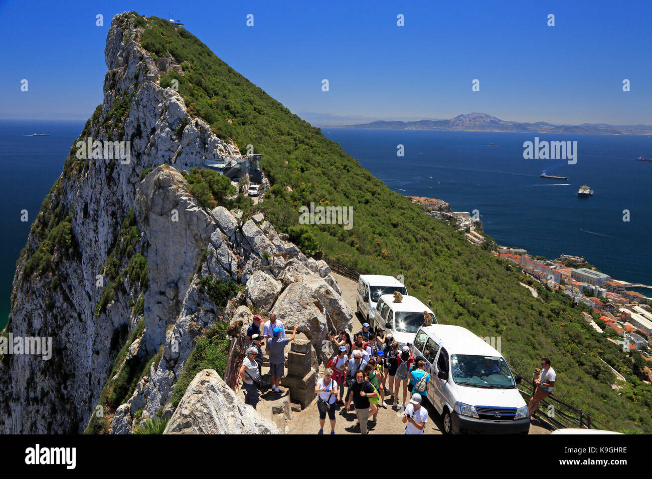 GIBRALTAR, GREAT BRITAIN - JULY 01, 2017: Tourists arriving with buses and enjoying the landscape of Gibraltar the British Overseas Territory. Stock Photo