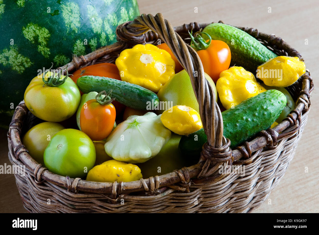 Fresh vegetables from the garden in a wicker basket. Still life Stock ...