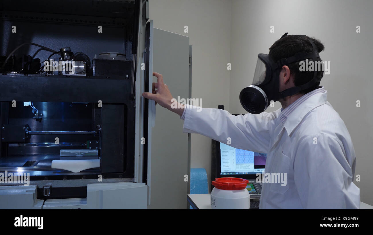 Male scientist in a gas mask in laboratory Stock Photo Alamy