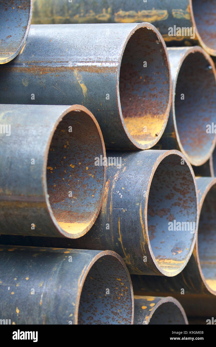 Metal profile pipe of round section in packs at the warehouse of metal ...