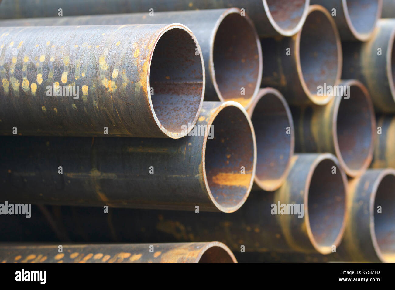 Metal profile pipe of round section in packs at the warehouse of metal ...