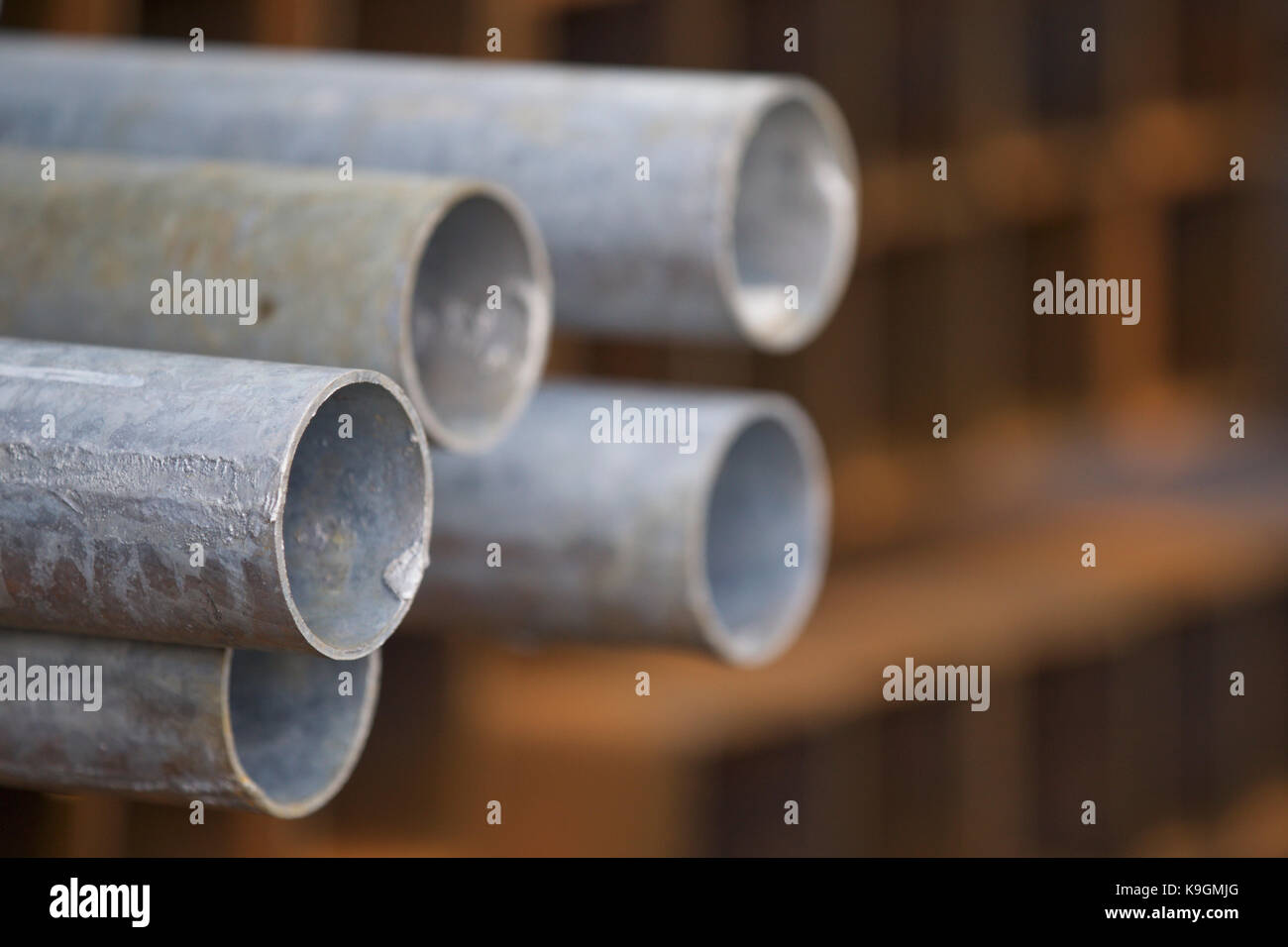 Metal profile pipe of round section in packs at the warehouse of metal ...