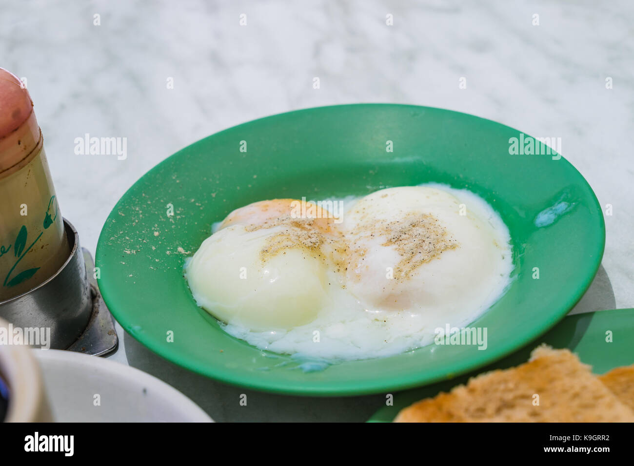 Halfboiled eggs, Traditional Singapore Breakfast called Kaya Toast, Original bread toast with