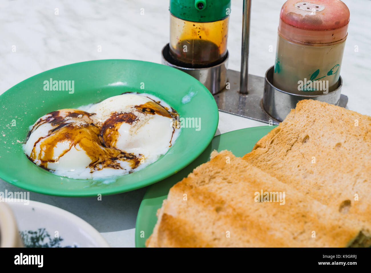 Traditional Singapore Breakfast called Kaya Toast, Bread with Coconut