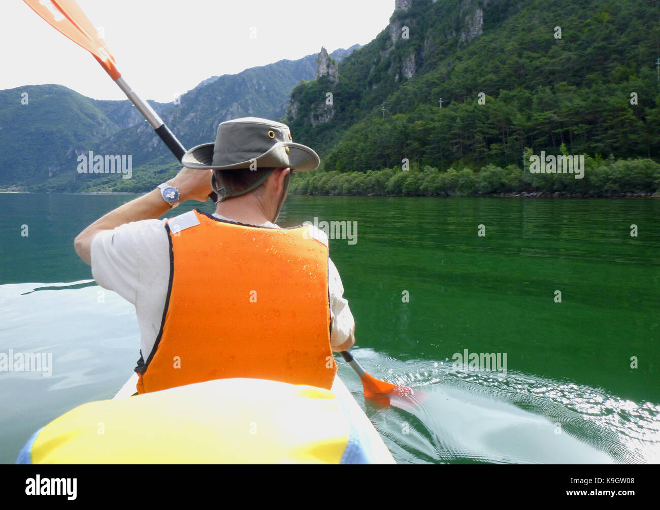 Man kayaking on Lake Idro Stock Photo - Alamy