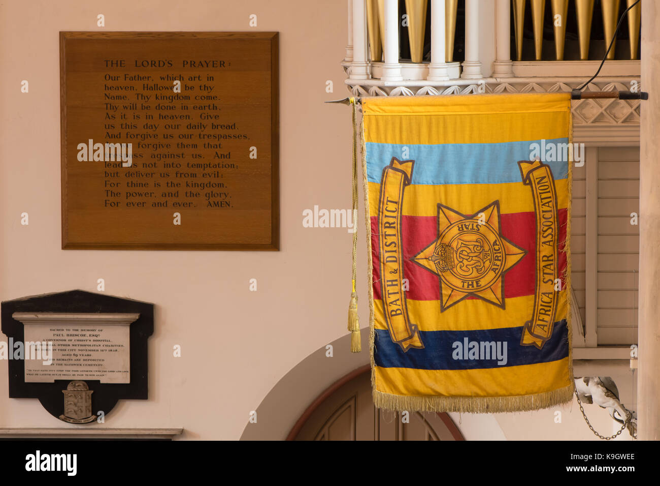 Bath and District Africa Star Association flag. Banner hanging in Saint Michael's Without Church with The Lord's Prayer in the background Stock Photo