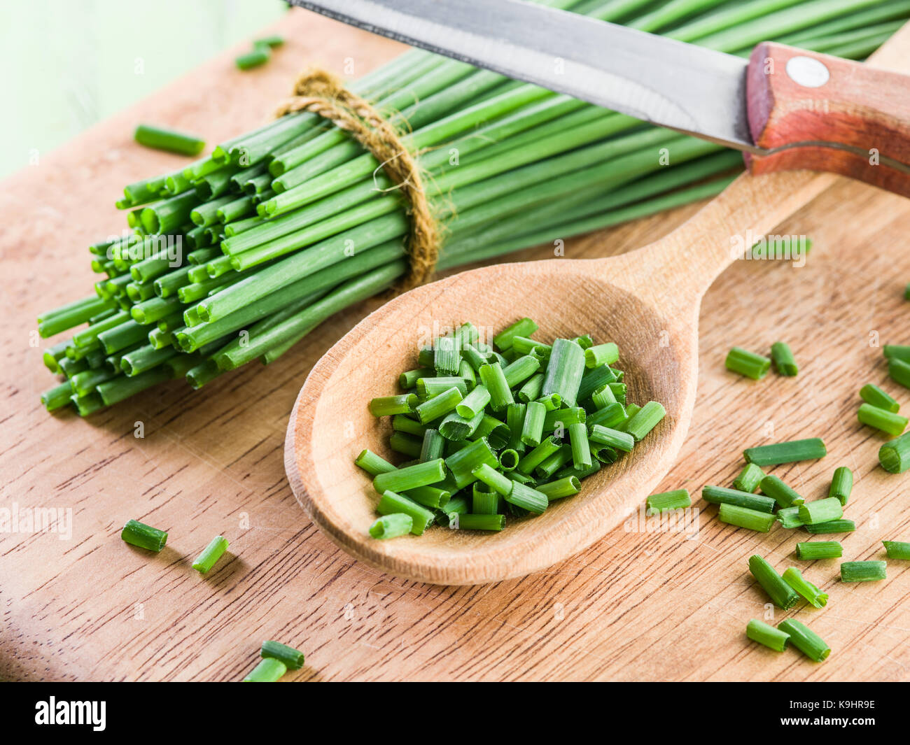 Green onion on the wooden table Stock Photo - Alamy