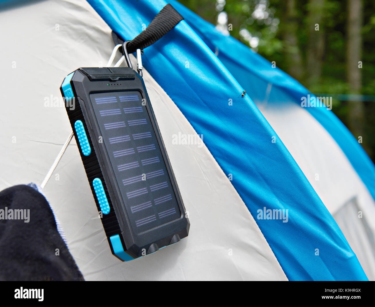 Hiking portable battery with solar panels on tent Stock Photo Alamy