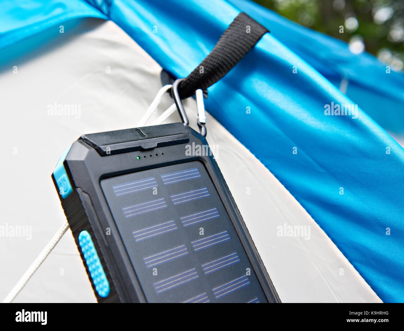Hiking portable battery with solar panels on tent Stock Photo Alamy