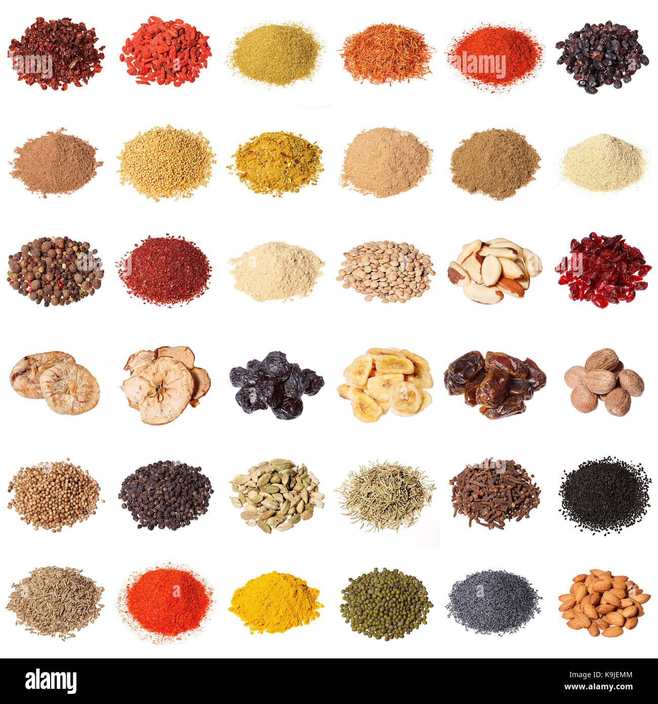 Large collection of different spices, herbs, nuts, dried fruits, beans, berries isolated on white background. Stock Photo