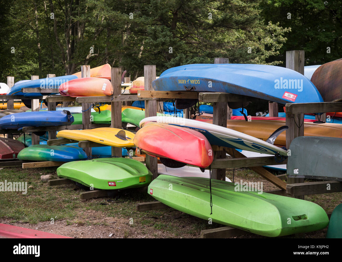 Kayaks and canoes next to a lake Stock Photo Alamy