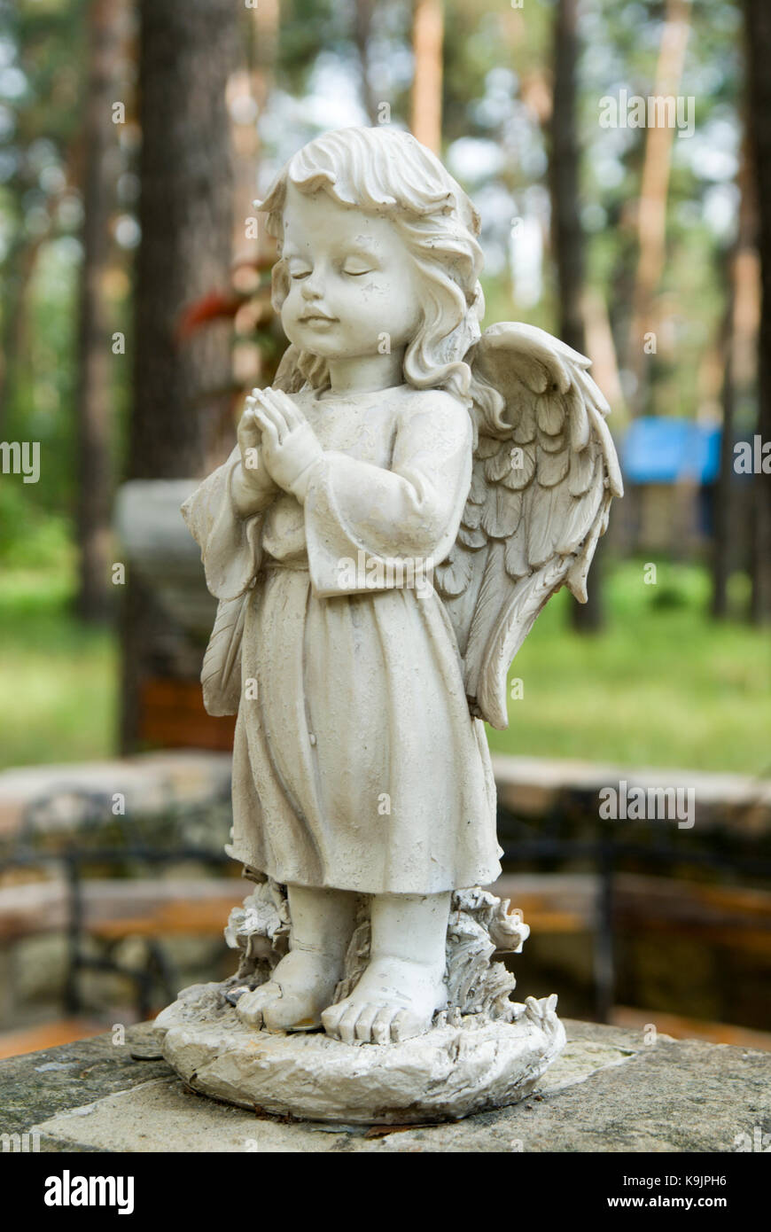 the little angel statue in city park Stock Photo Alamy