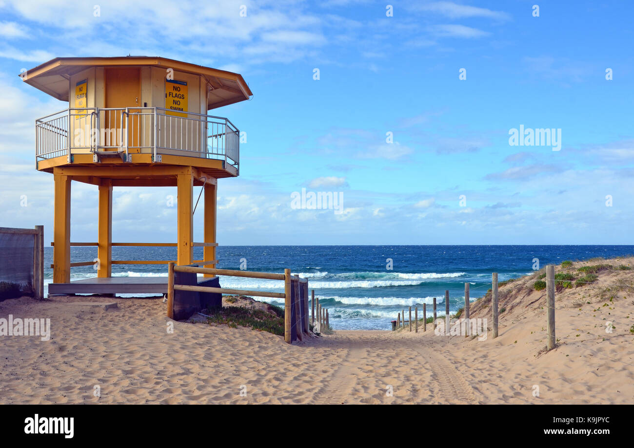 Yellow lifesavers hut and path leading onto Wanda Beach, Cronulla, New South Wales, Australia. Stock Photo