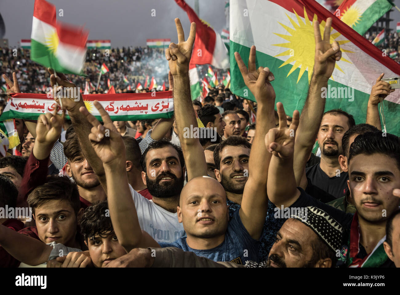 Erbil, Iraqi Kurdistan. 22nd Sep, 2017. Attendees at the final pro Kurdish Independence Referendum rally, held at the Franso Hariri Stadium in Erbil, wave flags and raise banners in support of an Independent State. 22nd September 2017. Credit: Elizabeth Fitt/Alamy Live News Stock Photo