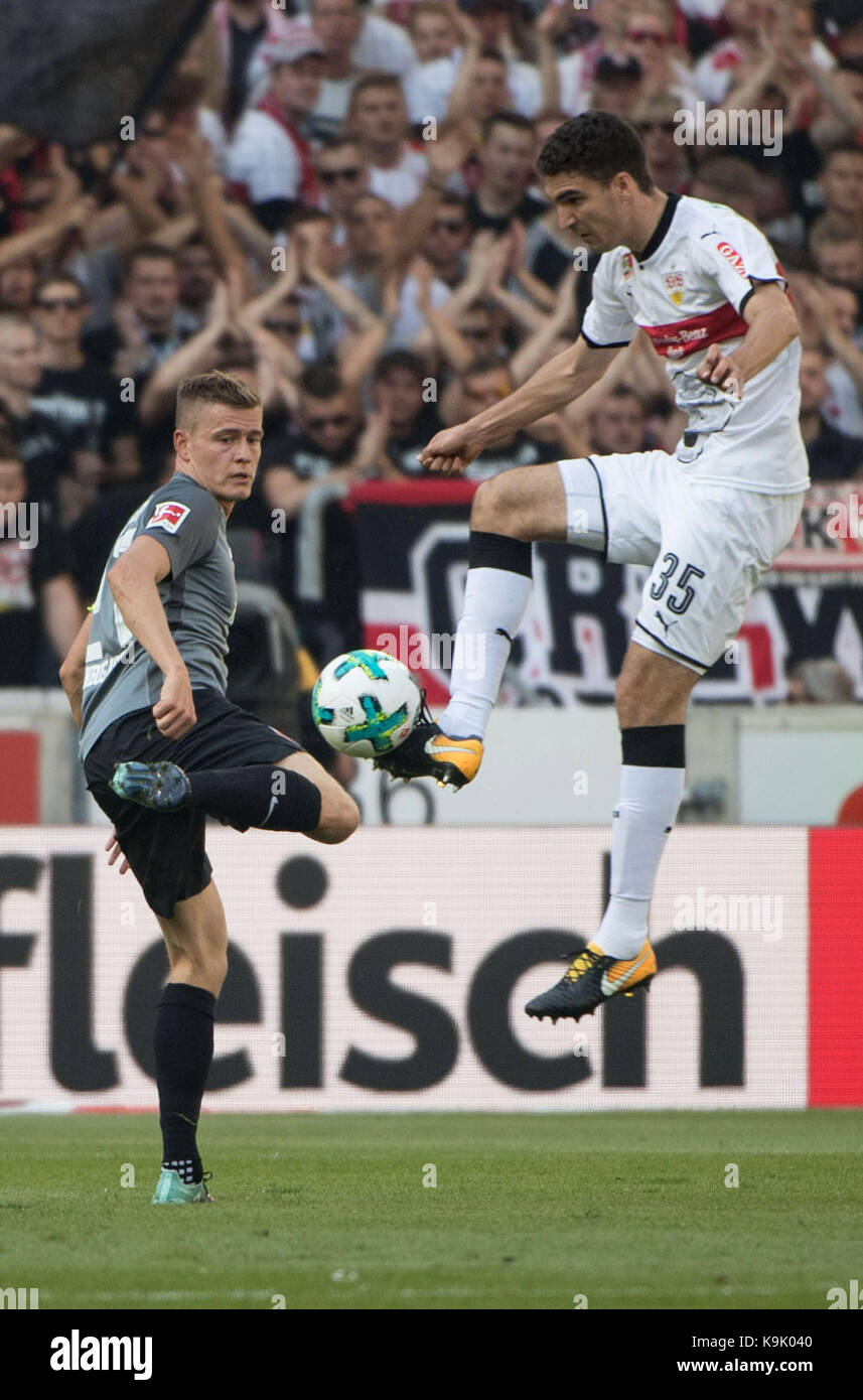Stuttgart, Germany. 23rd Sep, 2017. Stuttgart's Marcin Kaminski (R) and Augsburg's Alfred Finnbogason vie for the ball during the German Bundesliga match between VfB Stuttgart and FC Augsburg at the Mercedes-Benz-Arena in Stuttgart, Germany, 23 September 2017. (EMBARGO CONDITIONS - ATTENTION: Due to the accreditation guidelines, the DFL only permits the publication and utilisation of up to 15 pictures per match on the internet and in online media during the match.) Credit: Marijan Murat/dpa/Alamy Live News Stock Photo