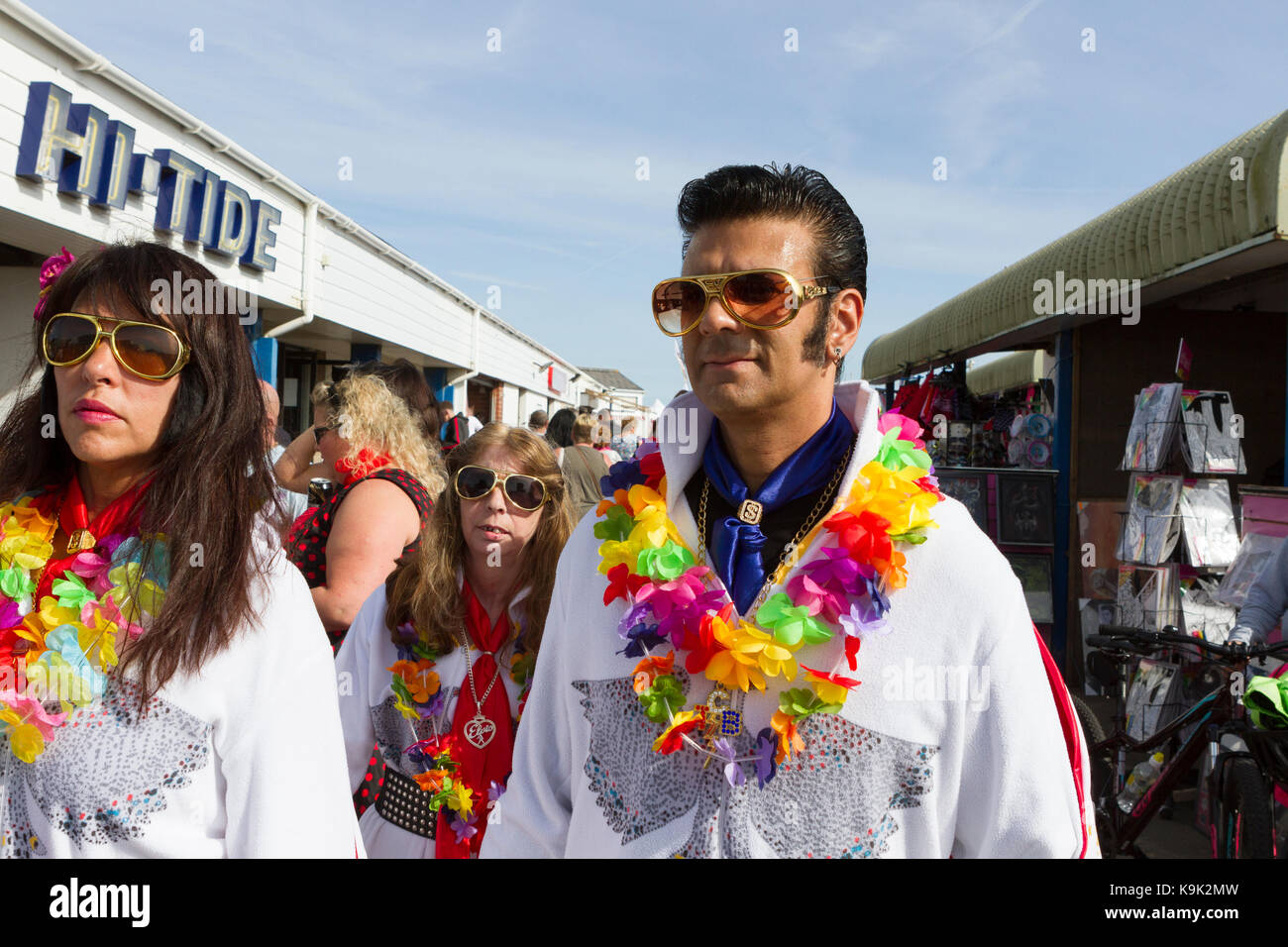 Elvis look-a-like and women in fancy dress at an Elvis Presley Festival in Porthcawl, Wales Stock Photo