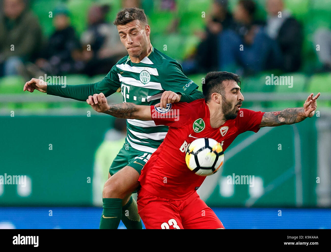 BUDAPEST, HUNGARY - JUNE 27: (l-r) Tokmac Chol Nguen of Ferencvarosi TC  fights for the ball with Dániel Farkas of Mezokovesd Zsory FC during the  Hungarian OTP Bank Liga match between Ferencvarosi TC and Mezokovesd Zsory  FC at Groupama