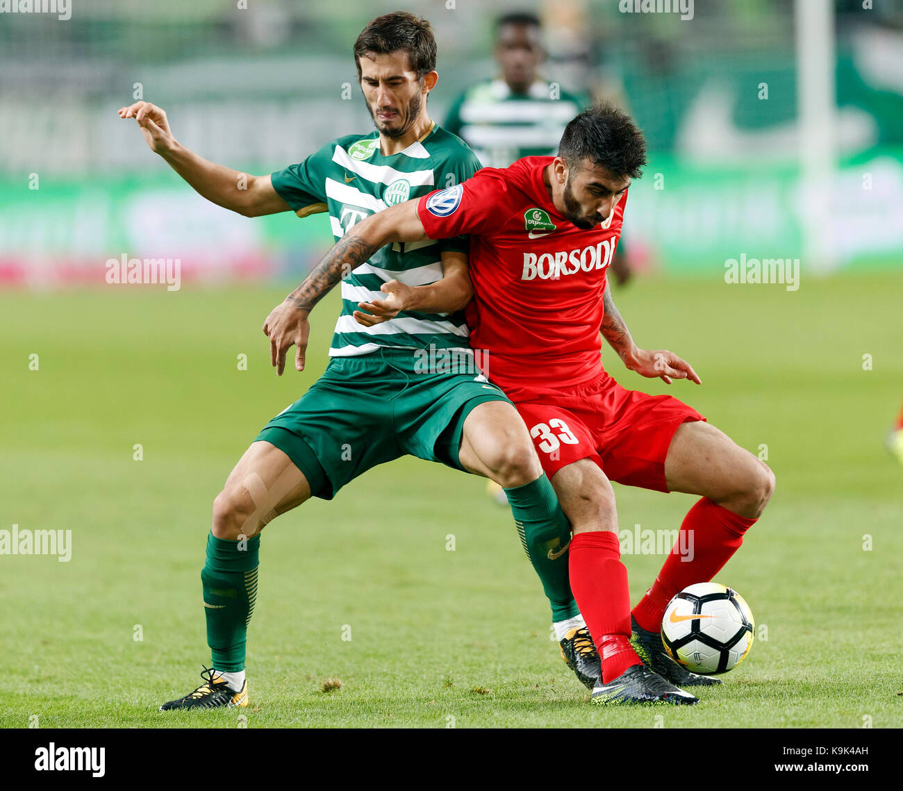 BUDAPEST, HUNGARY - JULY 12: (r-l) Roland Varga of Ferencvarosi TC hugs  goal scorer Stefan