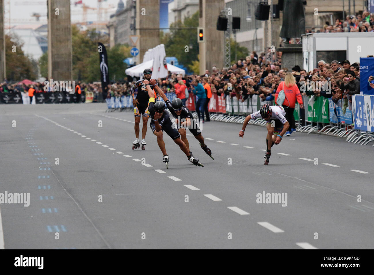 Berlin, Germany. 23rd September 2017. Second place Patxi Peula from Spain crosses the finishing line.Skaters race the last meters of the course from the Brandenburg Gate to the finishing line. Over 5,500 skater took part in the 2017 BMW Berlin Marathon Inline skating race, a day ahead of the Marathon race. Bart Swings from Belgium won the race in 58:42 for the 5th year in a row. Credit: Michael Debets/Alamy Live News Stock Photo