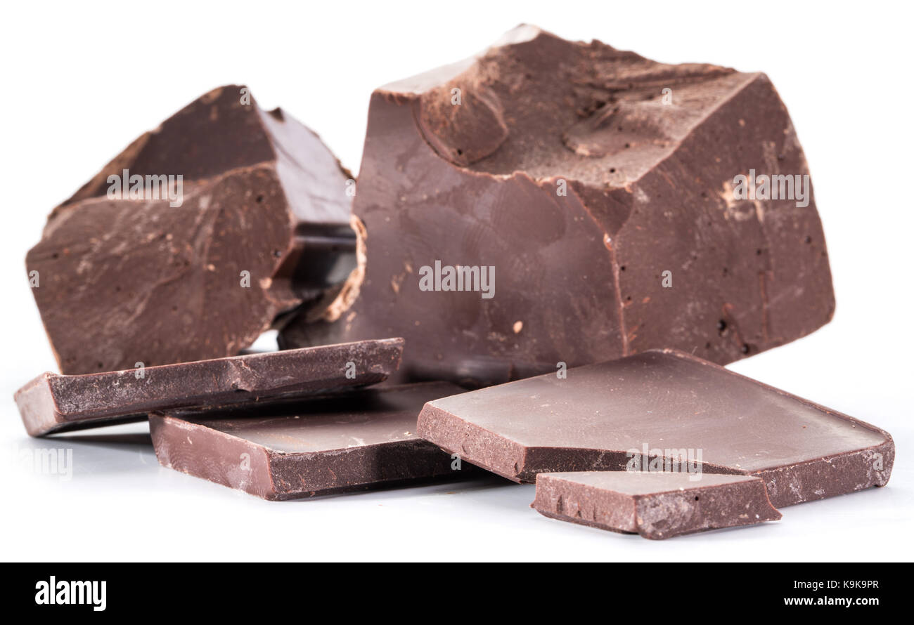 Chocolate blocks and pieces of chocolate bar isolated on a white background. Stock Photo