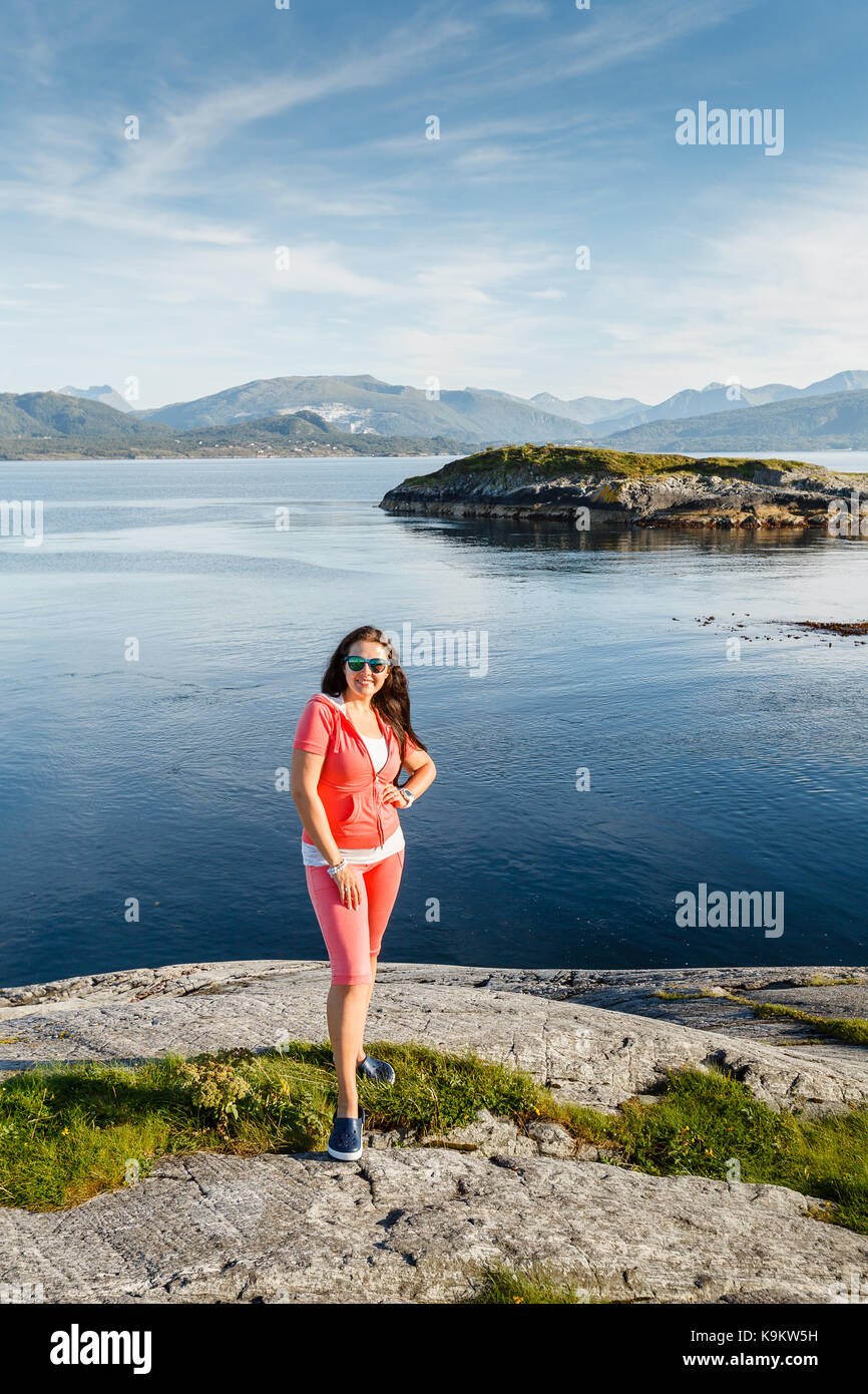 https://c8.alamy.com/comp/K9KW5H/young-woman-against-beautiful-view-on-norwegian-fjords-outdoor-shot-K9KW5H.jpg