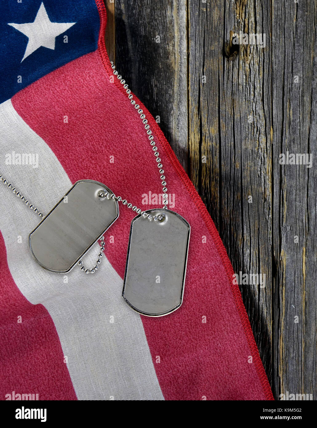 military dog tags and American flag on rustic wood Stock Photo - Alamy