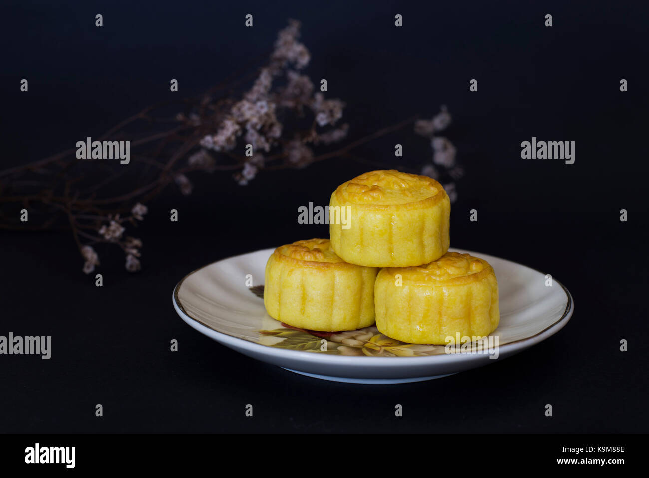 Chinese Traditional Mid Autumn Festival moon cakes on black background Stock Photo