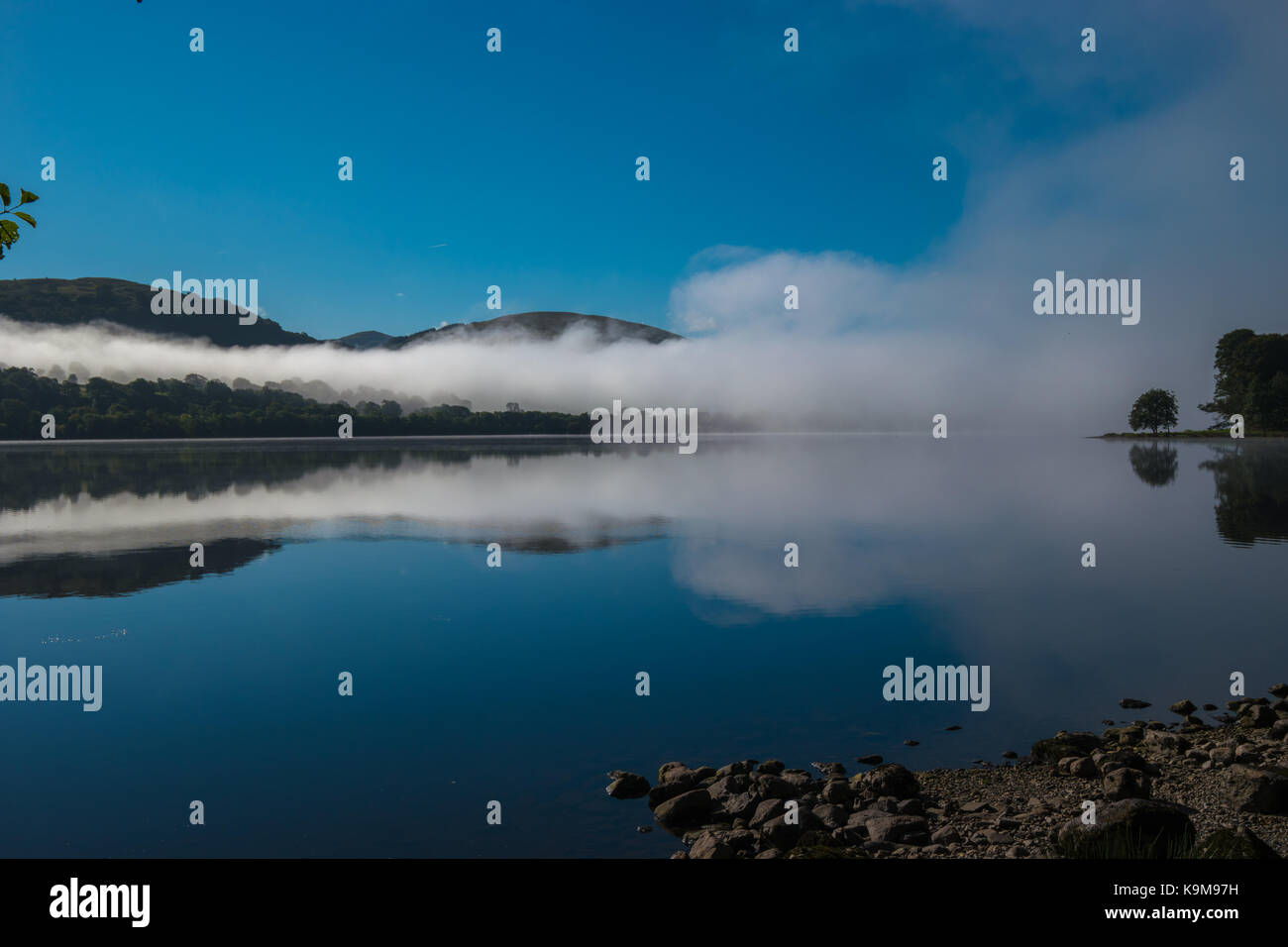 Smoke on the water, Bala Lake with mist and blue sky. Stock Photo