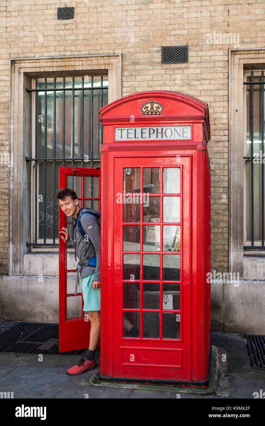 Young Man Comes Out Of Red Phone Booth London England Great Stock Photo Alamy