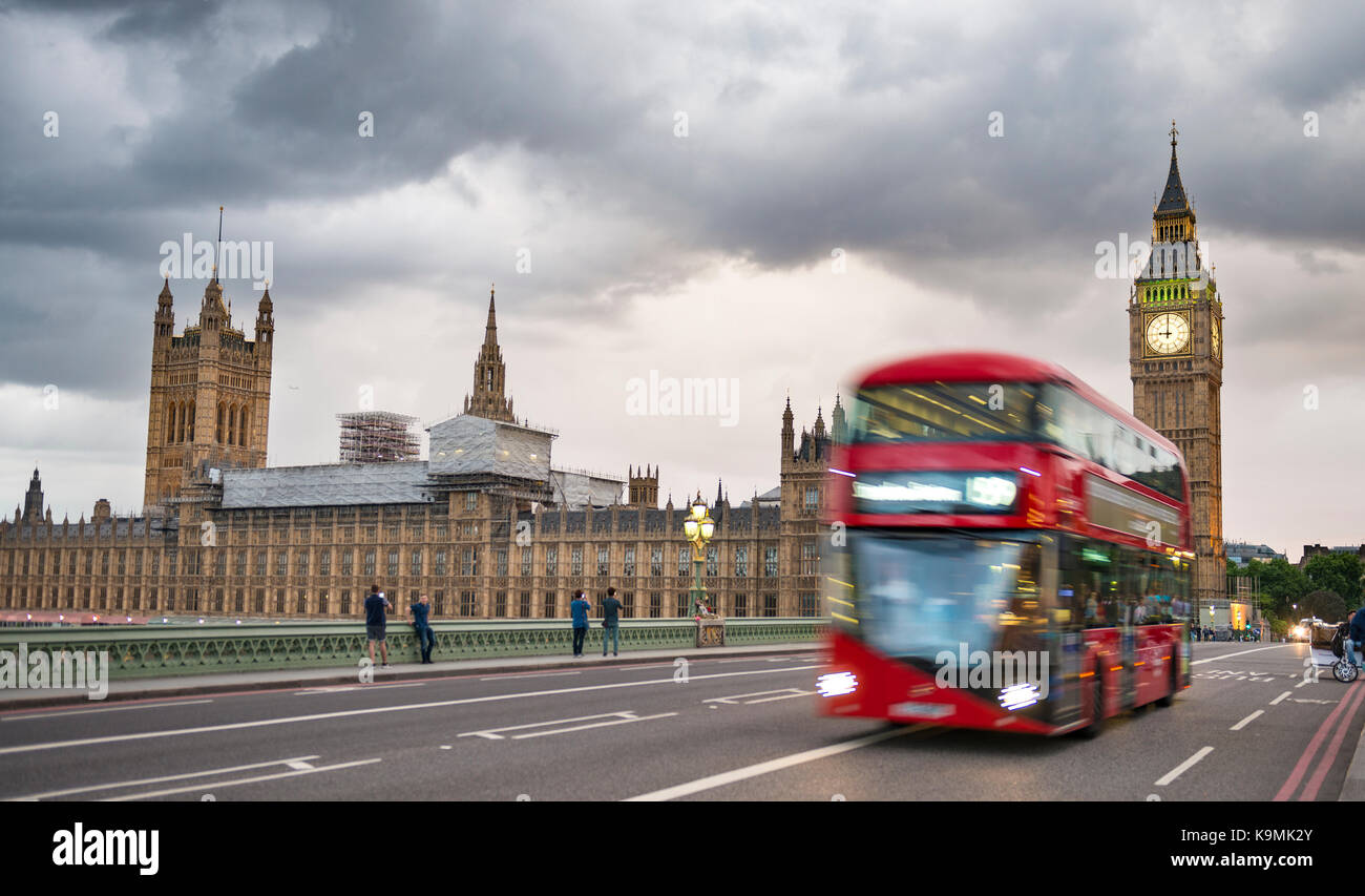 Red double-decker bus on the Westminster Bridge, Palace of Westminster and Big Ben, London, England, Great Britain Stock Photo
