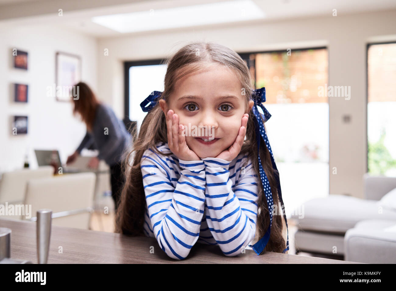 Portrait of smiling little girl at home Stock Photo - Alamy