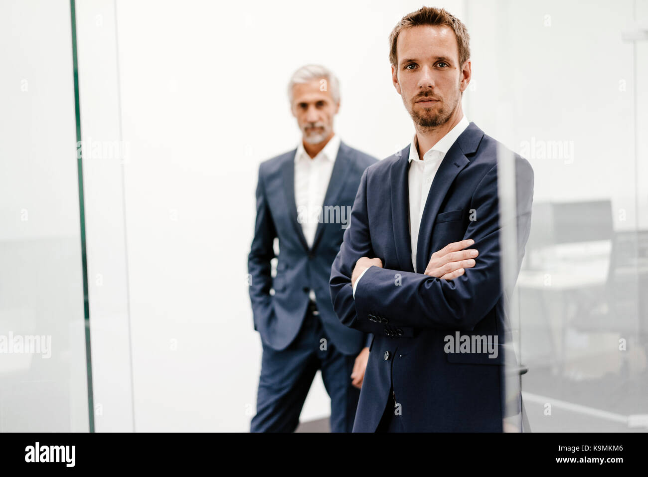 Portrait of two businessmen in office Stock Photo - Alamy