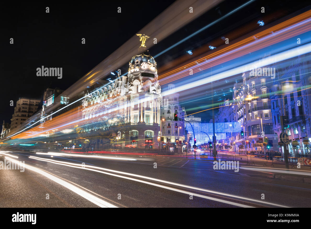 Night photography of Madrid cityscape, Gran Via street with rays of traffic light. Madrid, Spain. Stock Photo