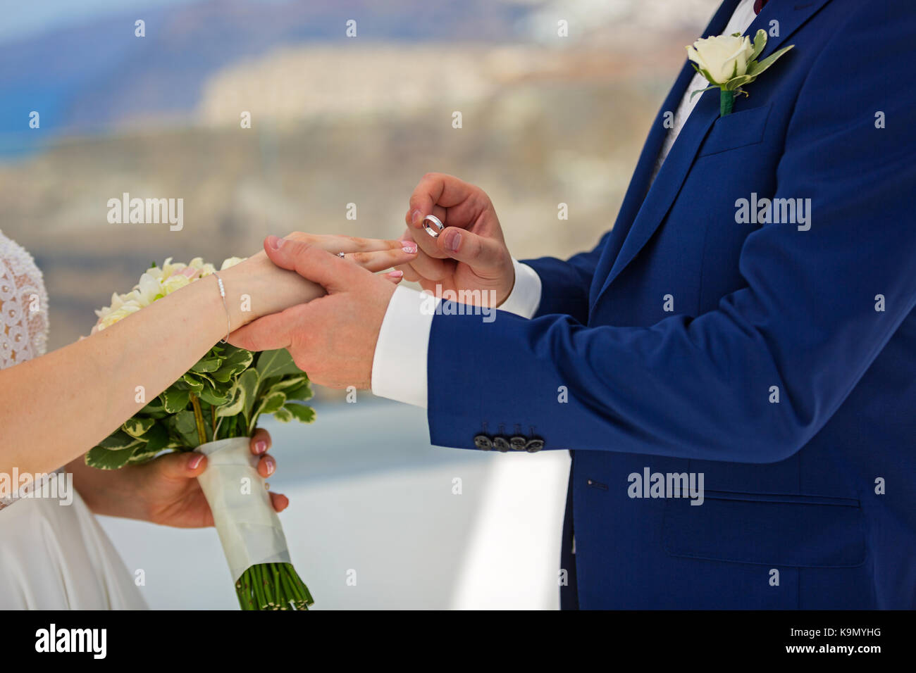 Wedding, the groom wears the ring bride Stock Photo - Alamy